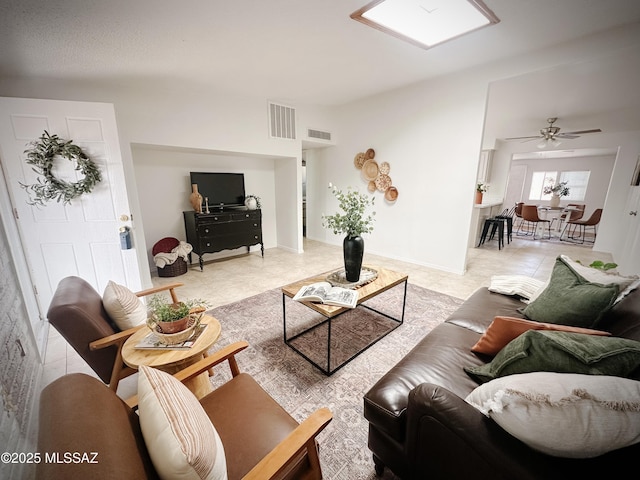 living room featuring ceiling fan