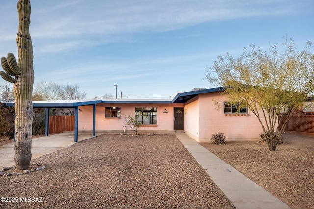 ranch-style home with a carport