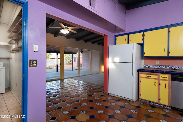 kitchen featuring washer / clothes dryer, dishwasher, white fridge, ceiling fan, and beam ceiling