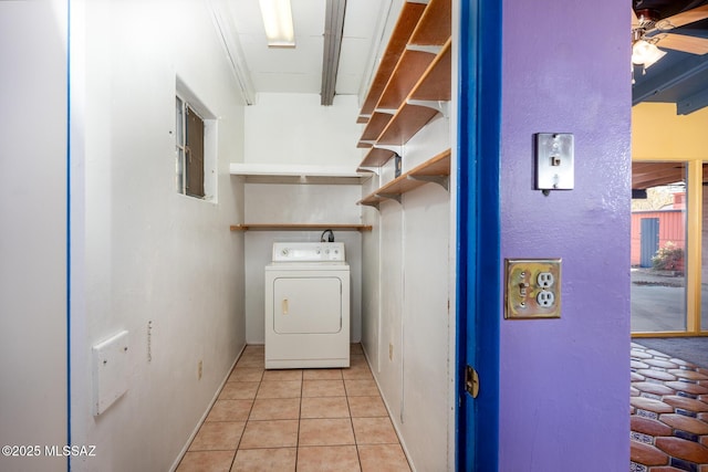 clothes washing area with washer / clothes dryer, light tile patterned floors, and ceiling fan