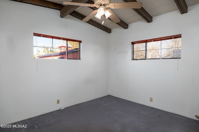 carpeted spare room featuring ceiling fan, plenty of natural light, and lofted ceiling with beams