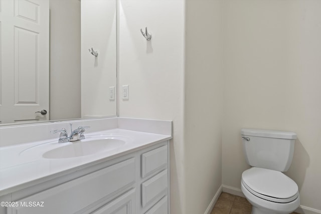 bathroom with tile patterned floors, toilet, and vanity