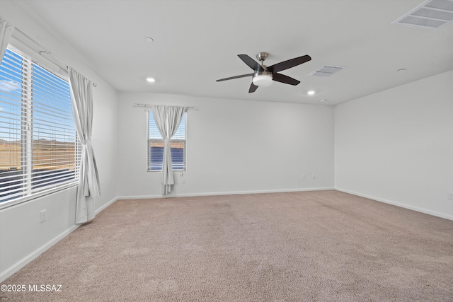 empty room with light carpet and ceiling fan