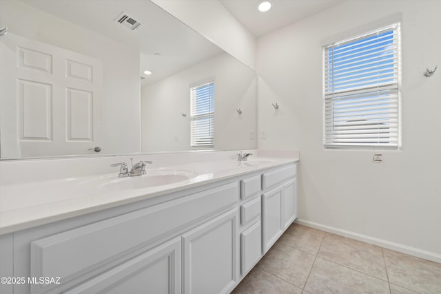 bathroom featuring tile patterned flooring and vanity