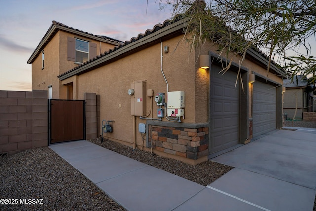 view of property exterior at dusk