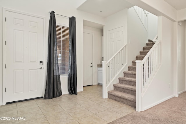 entrance foyer with light tile patterned flooring