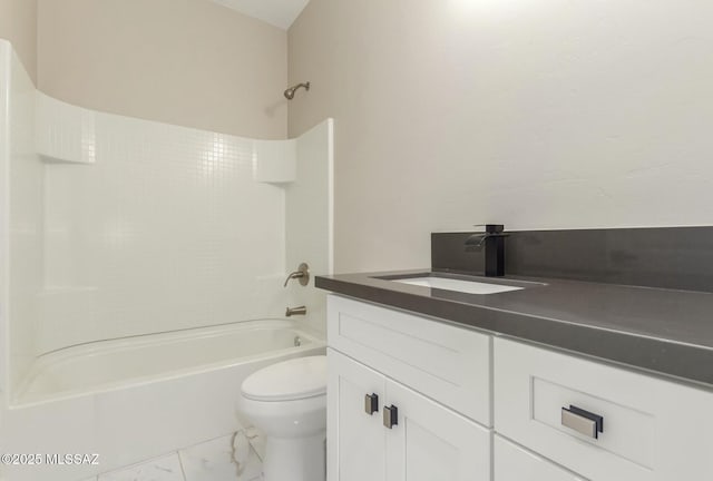 bathroom featuring marble finish floor, shower / washtub combination, vanity, and toilet