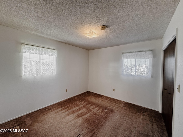 281 E Walker St, Benson, AZ 85602 - carpeted spare room with a textured ceiling