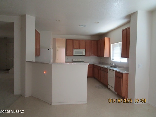 kitchen featuring sink and white appliances