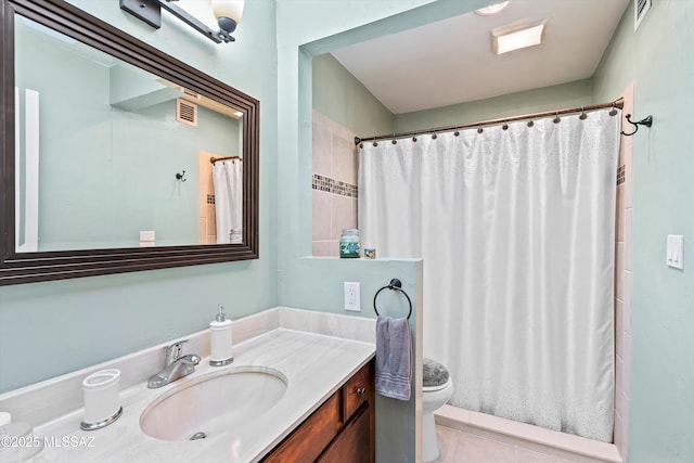 bathroom featuring vanity, toilet, tile patterned floors, and a shower with shower curtain