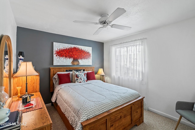 bedroom featuring ceiling fan and carpet floors