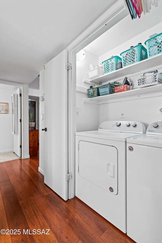 laundry room featuring dark wood-type flooring and washer and dryer