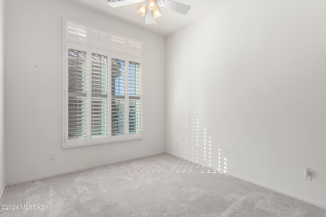 carpeted empty room with ceiling fan