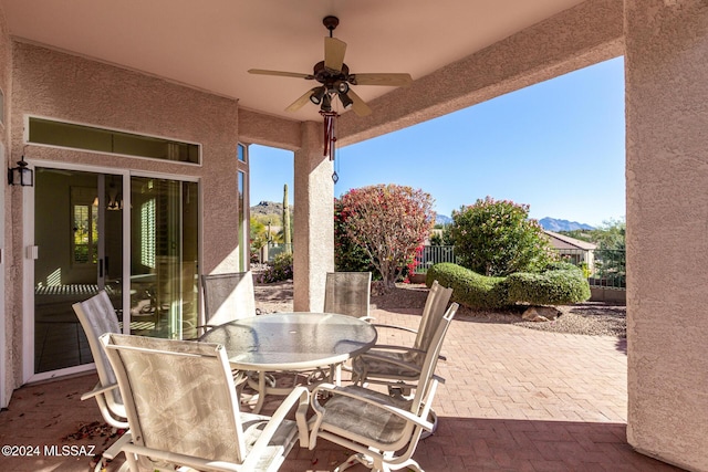 view of patio featuring ceiling fan