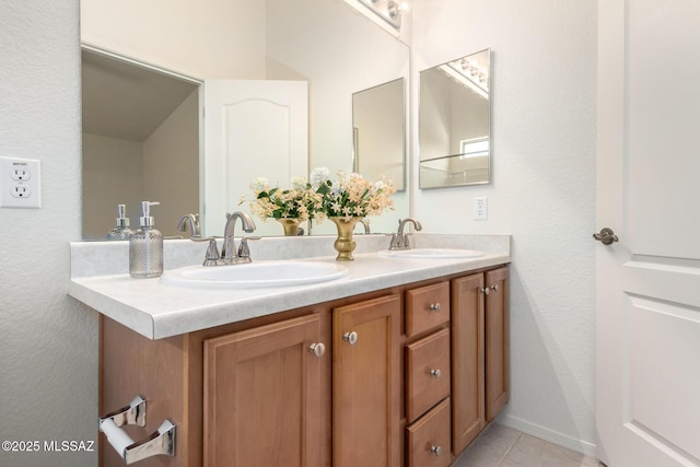 bathroom featuring tile patterned floors and vanity