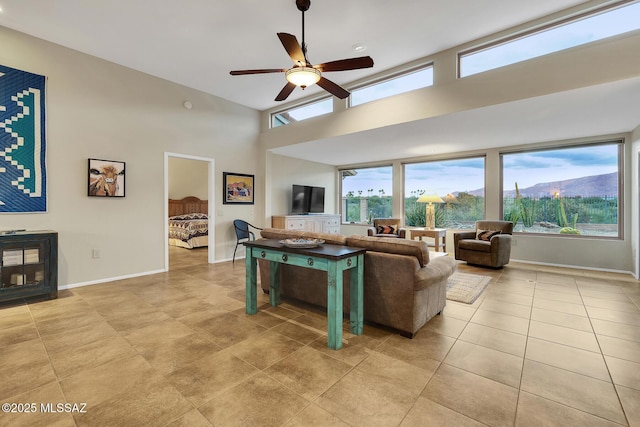 tiled living room featuring ceiling fan