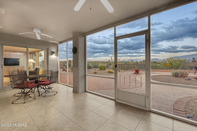 sunroom / solarium with ceiling fan