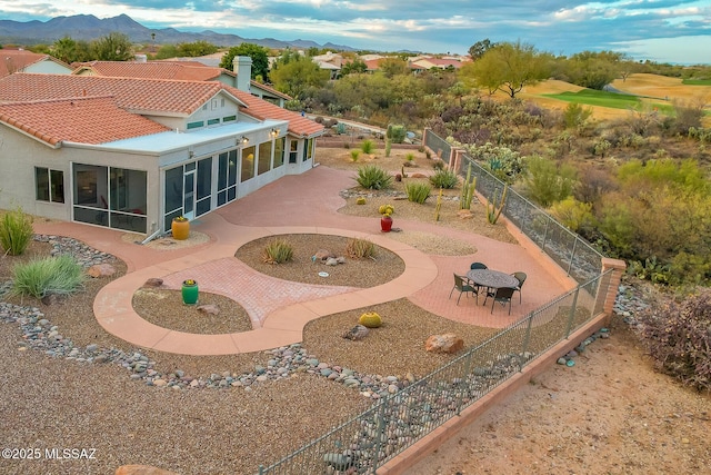 birds eye view of property with a mountain view