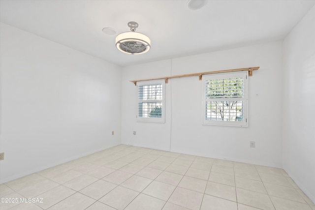 unfurnished room featuring light tile patterned floors