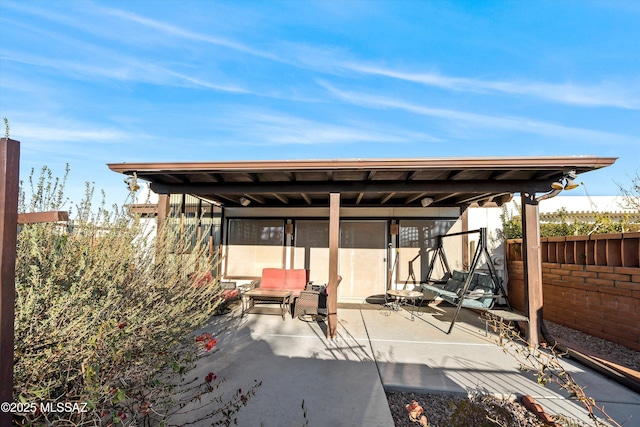 view of patio / terrace featuring fence