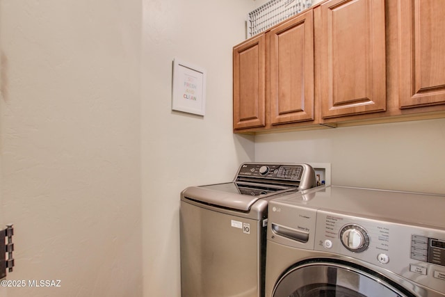 laundry area featuring cabinets and separate washer and dryer