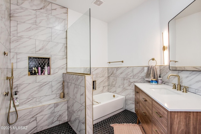 bathroom featuring vanity, tile walls, and independent shower and bath