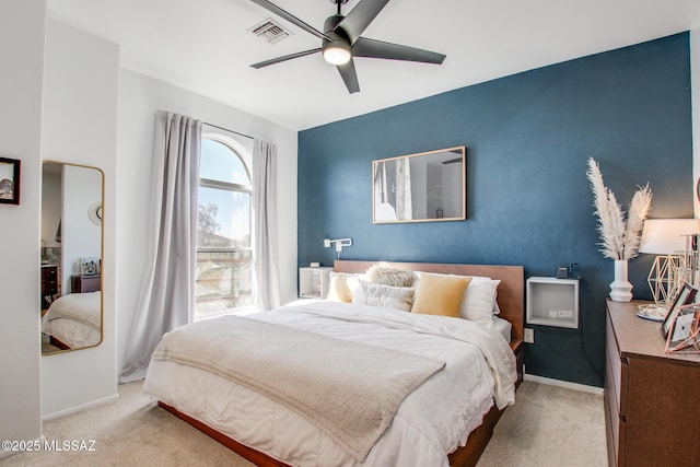 carpeted bedroom featuring ceiling fan