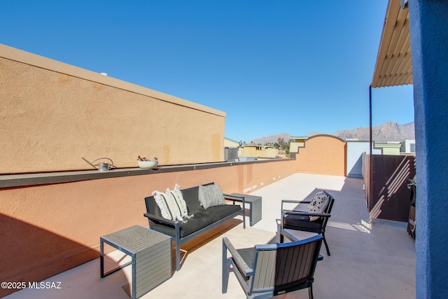 view of patio with a mountain view and an outdoor hangout area