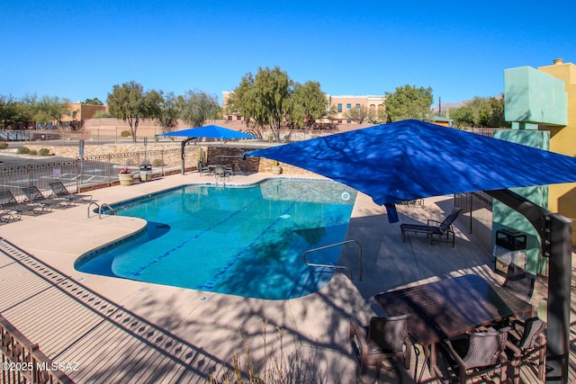 view of swimming pool with a patio