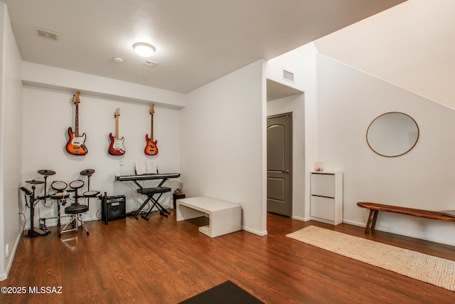 miscellaneous room with dark hardwood / wood-style floors