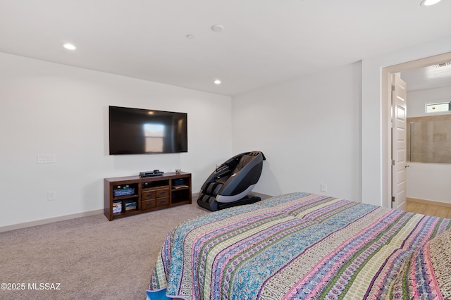 carpeted bedroom with baseboards, ensuite bathroom, and recessed lighting