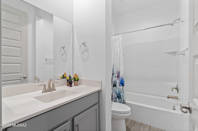 full bathroom with shower / bath combination with curtain, vanity, and toilet