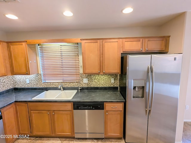 kitchen with light tile patterned floors, sink, and appliances with stainless steel finishes