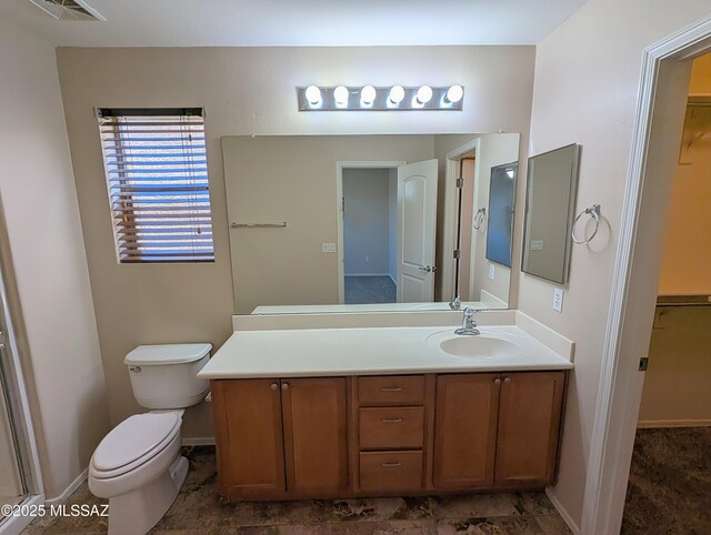 bathroom with toilet and vanity