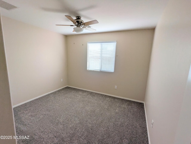 carpeted empty room featuring ceiling fan