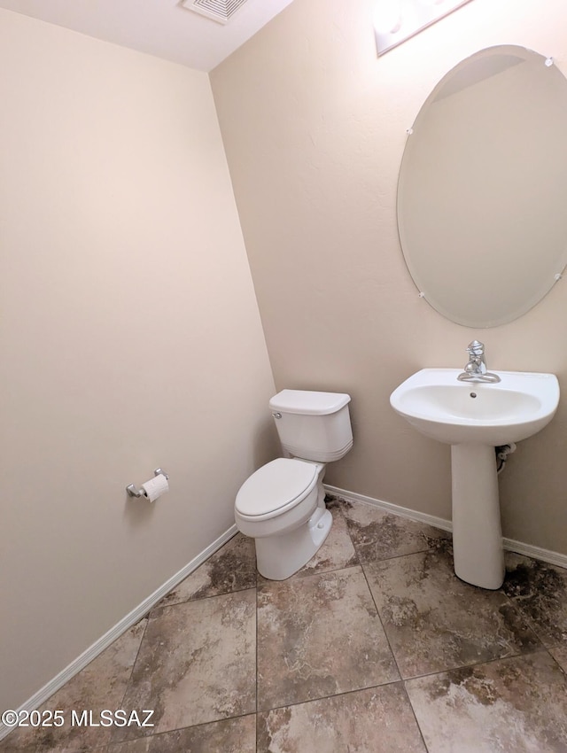 bathroom featuring toilet