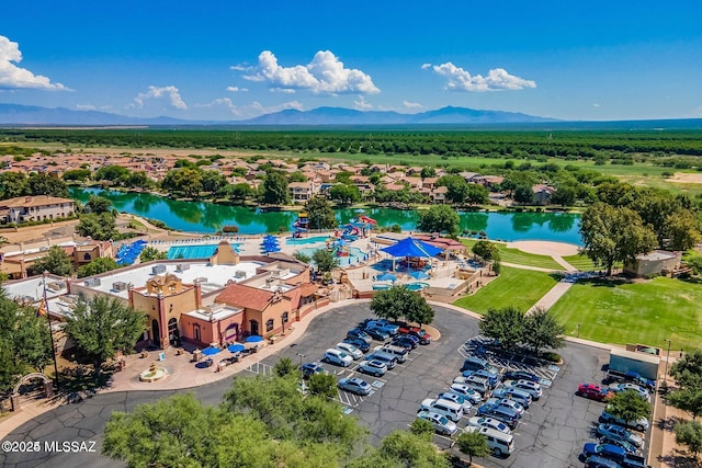 birds eye view of property featuring a water and mountain view