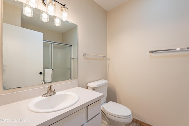 bathroom featuring walk in shower, vanity, and toilet