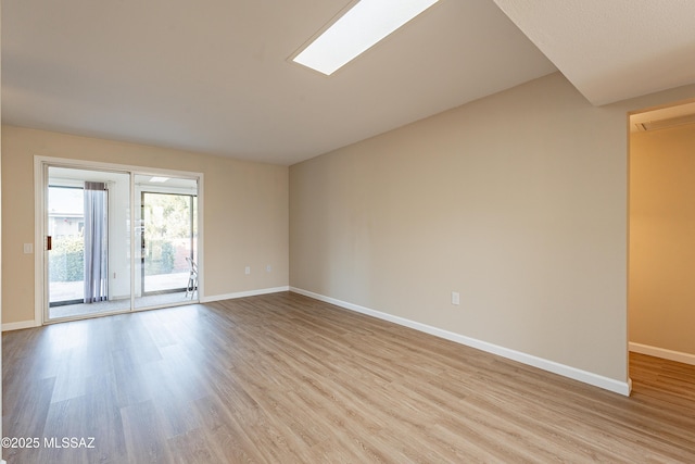 spare room featuring light wood-type flooring