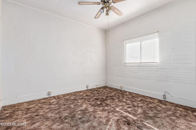 carpeted empty room with ceiling fan and ornamental molding