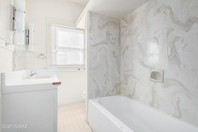 bathroom with toilet and vanity