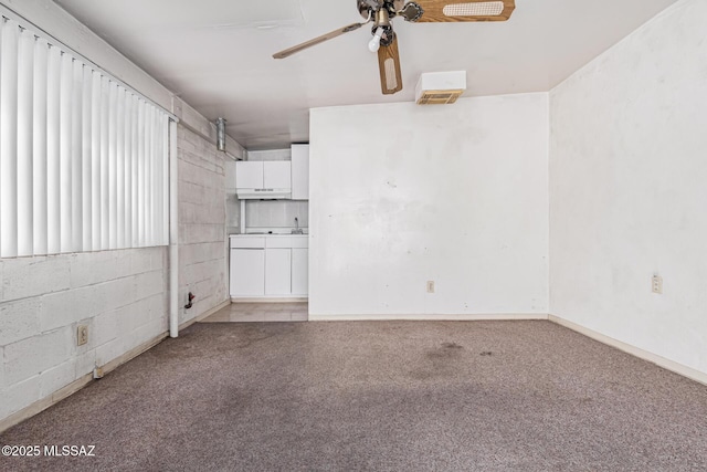 carpeted empty room with ceiling fan