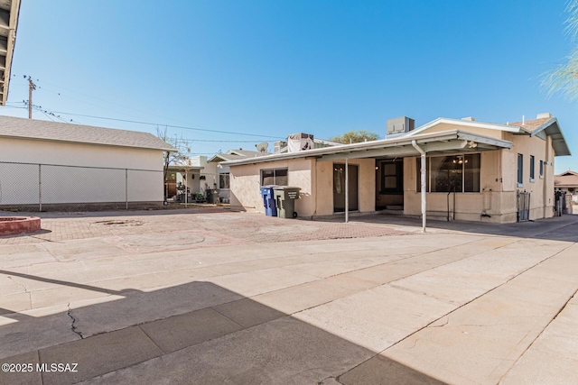 rear view of property featuring a patio