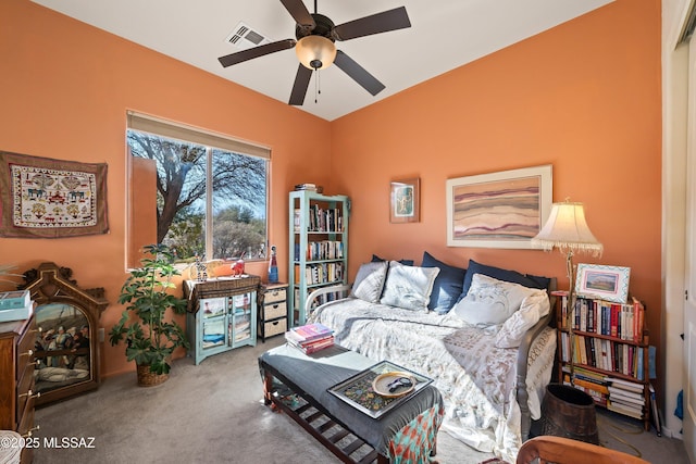 carpeted living room with ceiling fan