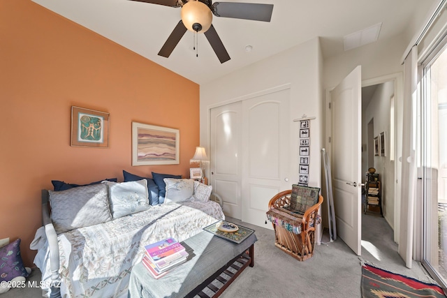 bedroom featuring ceiling fan, light colored carpet, and a closet