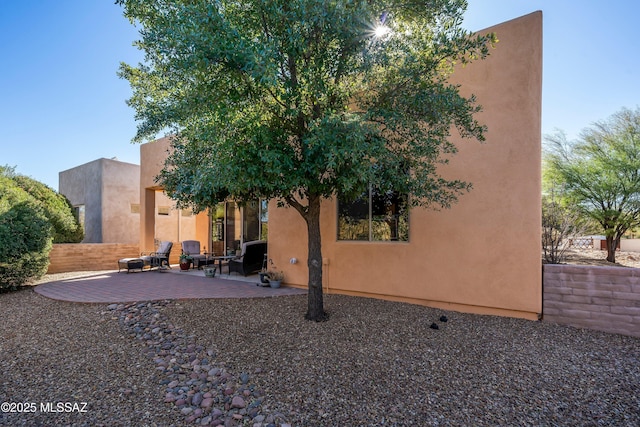 rear view of house featuring a patio area