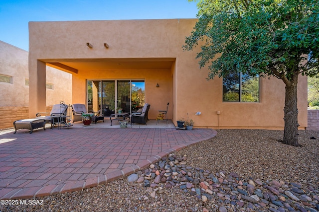 back of house featuring a patio area