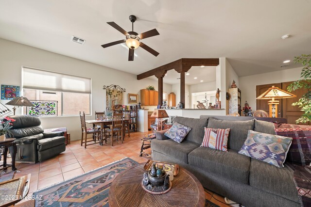 tiled living room featuring ceiling fan