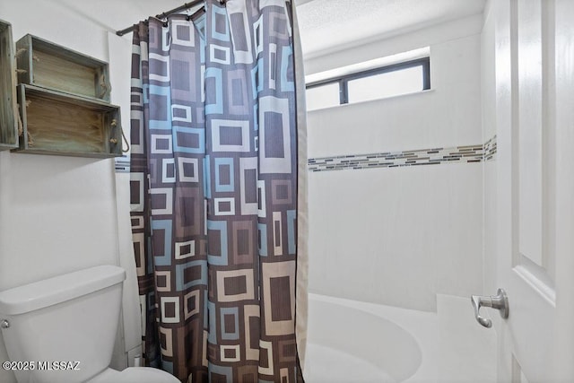 bathroom with toilet and shower / bath combo with shower curtain