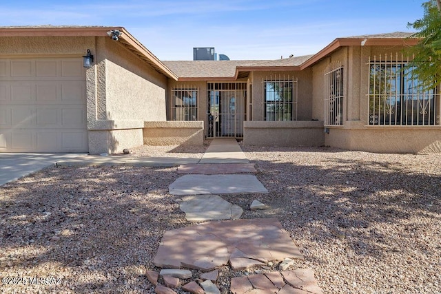 doorway to property featuring a garage